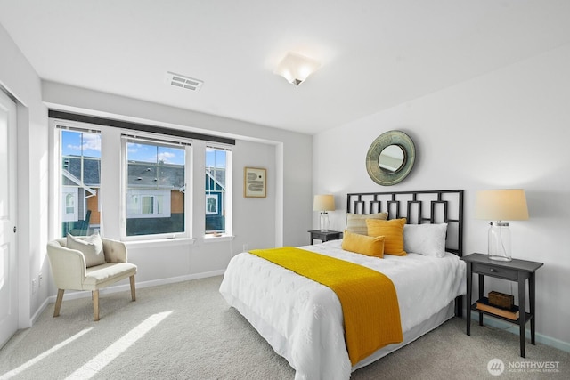 bedroom featuring visible vents, carpet floors, and baseboards