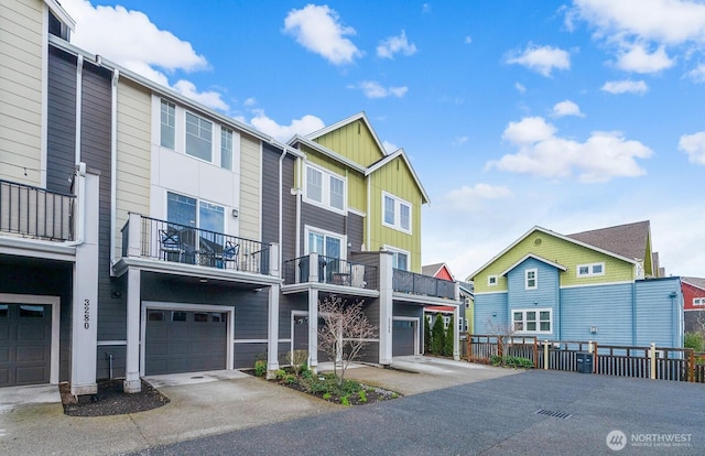 exterior space with a residential view, board and batten siding, and fence