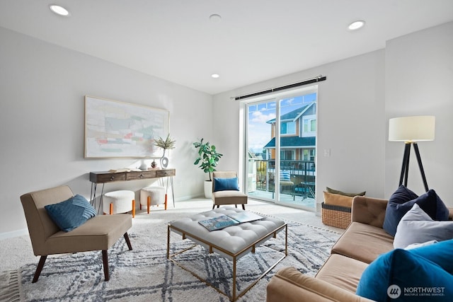 living area with carpet flooring, recessed lighting, and baseboards