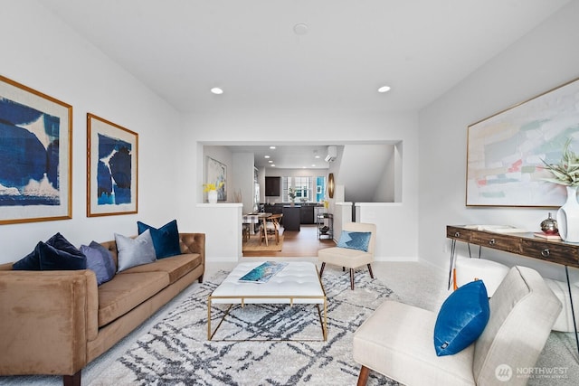 living area with recessed lighting and baseboards