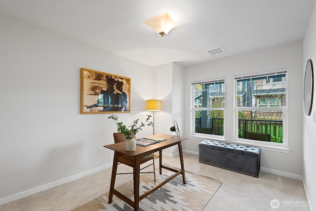 home office featuring visible vents, baseboards, and carpet