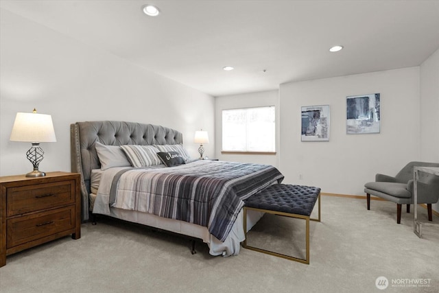 bedroom with recessed lighting, baseboards, and light carpet