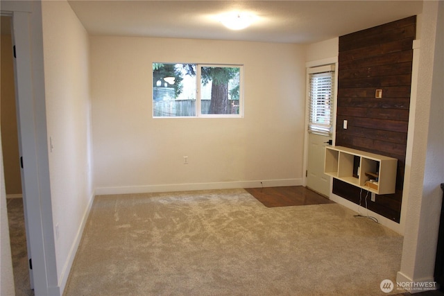 interior space with carpet flooring and baseboards