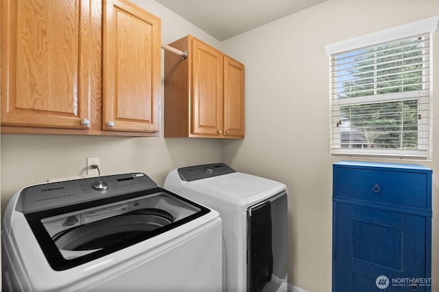 laundry room with cabinet space and independent washer and dryer