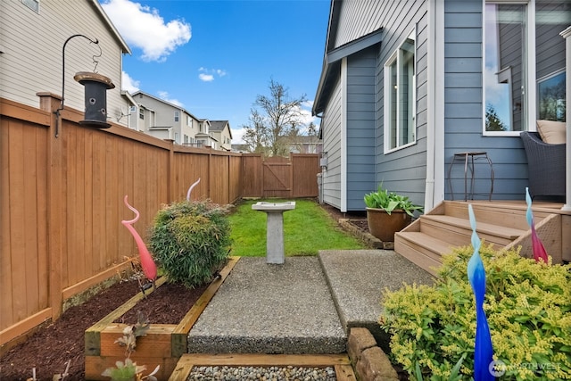 view of yard with a gate and fence