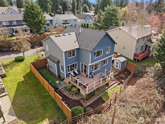 birds eye view of property with a residential view