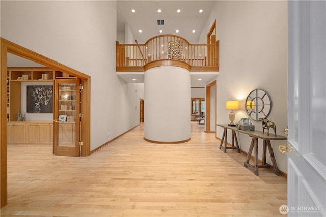 interior space featuring recessed lighting, visible vents, baseboards, and wood finished floors