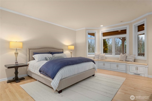 bedroom featuring recessed lighting, light wood-style floors, baseboards, and ornamental molding