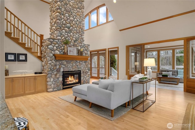 living room featuring french doors, wood finished floors, and a fireplace