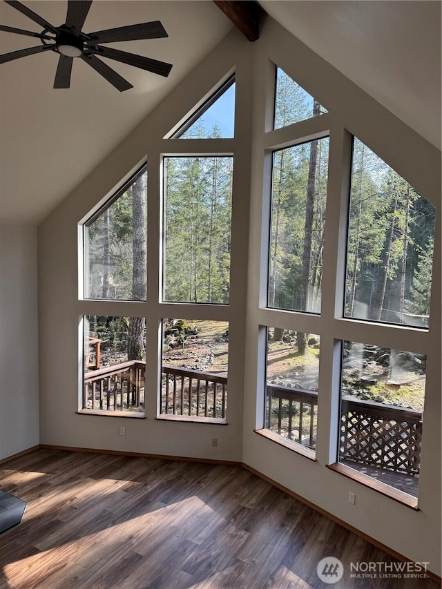 interior space with ceiling fan, beamed ceiling, high vaulted ceiling, and wood finished floors