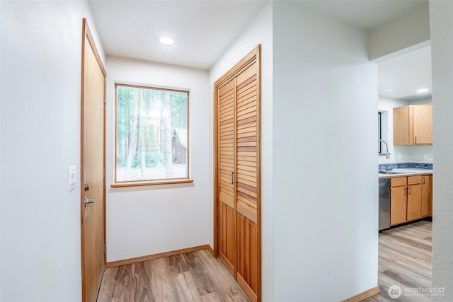213 Crescent Beach Dr, Packwood, WA 98361 - corridor with baseboards, a sink, light wood finished floors, and recessed lighting