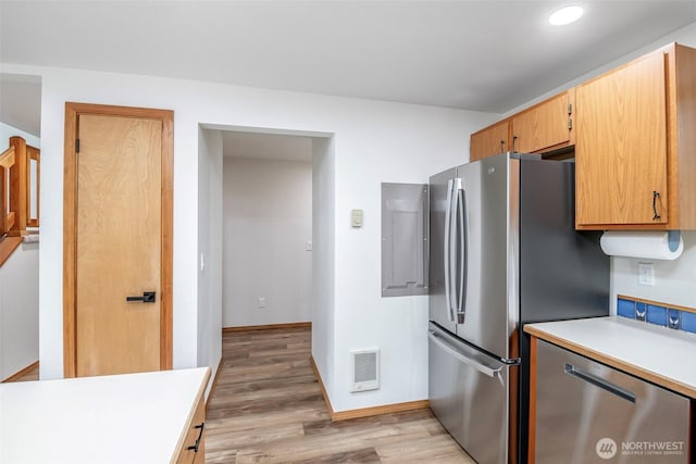 213 Crescent Beach Dr, Packwood, WA 98361 - kitchen featuring stainless steel appliances, light wood-style flooring, visible vents, recessed lighting, and light countertops