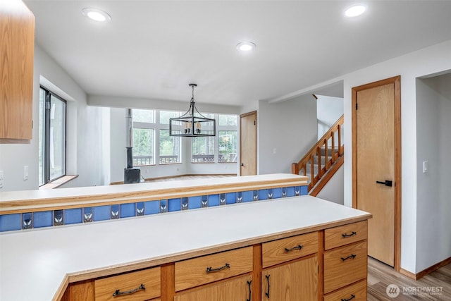 213 Crescent Beach Dr, Packwood, WA 98361 - kitchen with an inviting chandelier, recessed lighting, light wood-style floors, light countertops, and hanging light fixtures