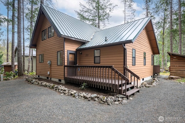 213 Crescent Beach Dr, Packwood, WA 98361 - view of front of property with a standing seam roof, a wooden deck, and metal roof