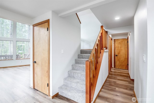 213 Crescent Beach Dr, Packwood, WA 98361 - staircase featuring baseboards, wood finished floors, and recessed lighting