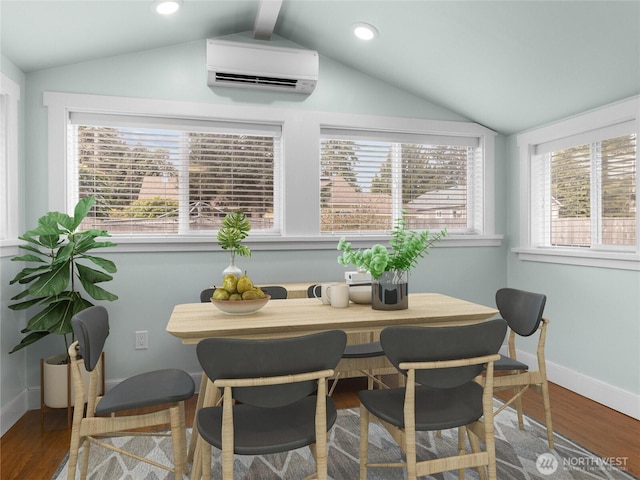 dining room featuring a wealth of natural light, an AC wall unit, lofted ceiling, and wood finished floors