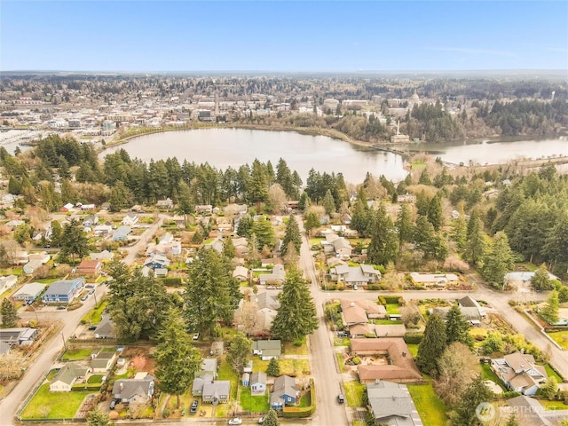 drone / aerial view with a water view and a residential view