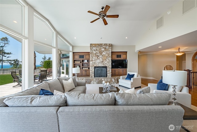 5685 Nakat Way, Blaine, WA 98230 - living room with a ceiling fan, high vaulted ceiling, a fireplace, wood finished floors, and recessed lighting