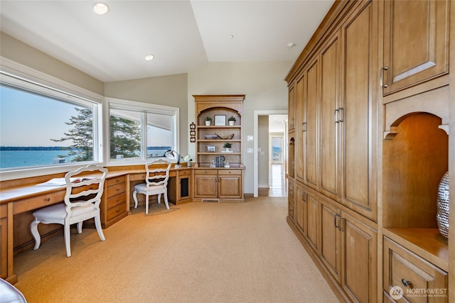 5685 Nakat Way, Blaine, WA 98230 - office area with light colored carpet, lofted ceiling, built in desk, arched walkways, and recessed lighting