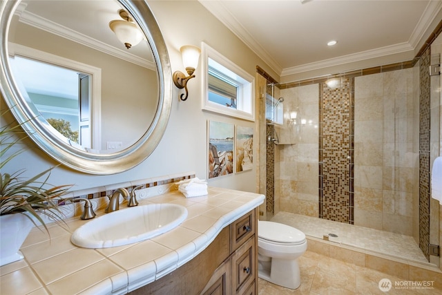 5685 Nakat Way, Blaine, WA 98230 - bathroom with tiled shower, vanity, toilet, and ornamental molding