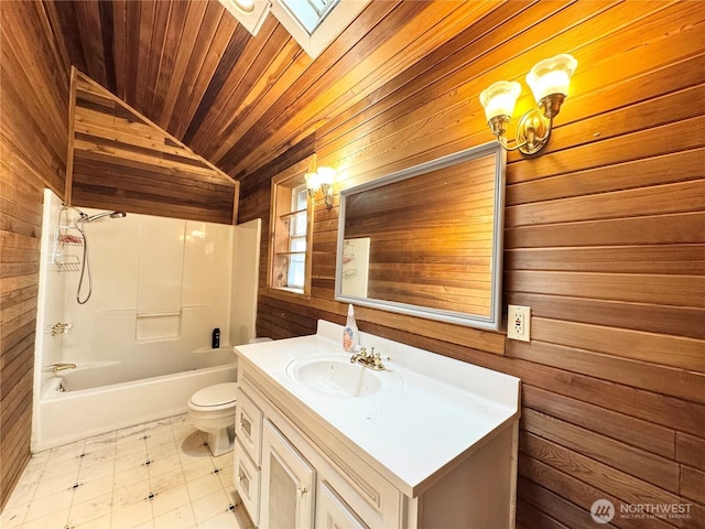 bathroom with toilet, wooden walls, wooden ceiling, washtub / shower combination, and vanity