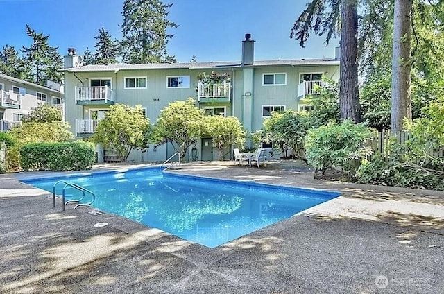 outdoor pool featuring a patio