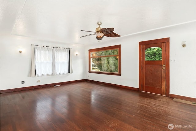 foyer featuring ceiling fan, baseboards, and wood finished floors