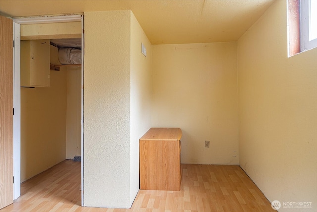 interior space featuring a closet and wood finished floors