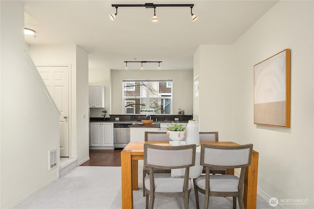 dining area with baseboards and visible vents