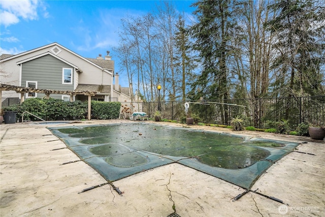 view of swimming pool with a patio area, a fenced in pool, a pergola, and a fenced backyard