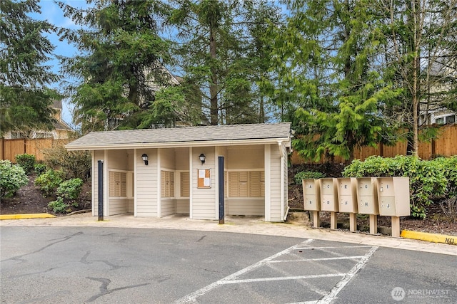 exterior space featuring fence and uncovered parking