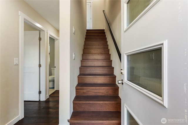 stairs with wood finished floors