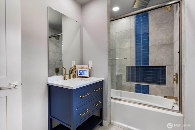 full bath with vanity and a combined bath / shower with rainfall shower