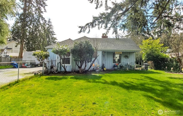 view of front facade with board and batten siding, a front lawn, fence, cooling unit, and a chimney