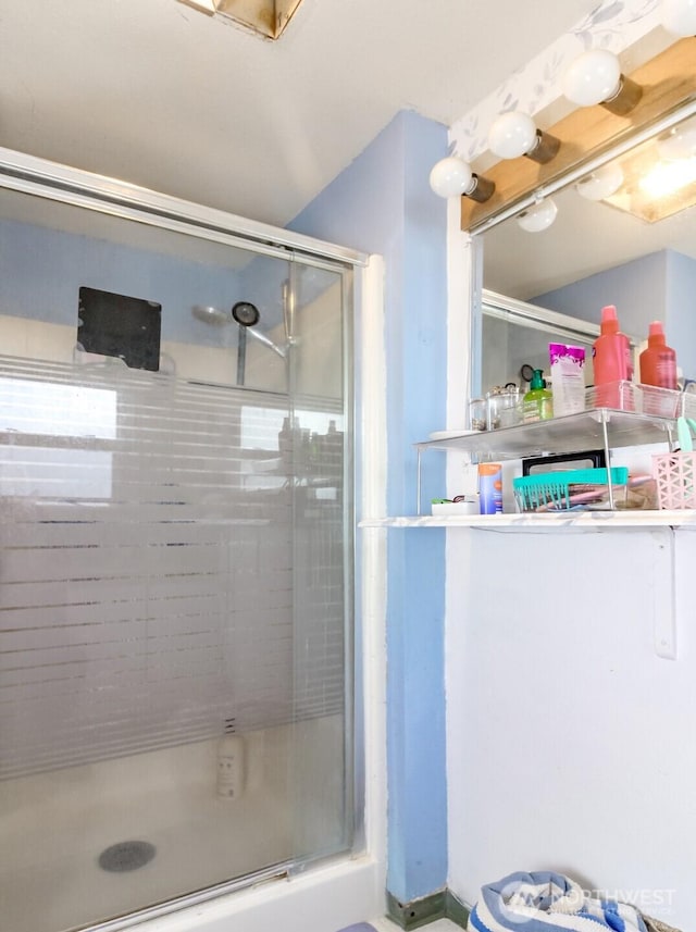 full bathroom with a shower stall