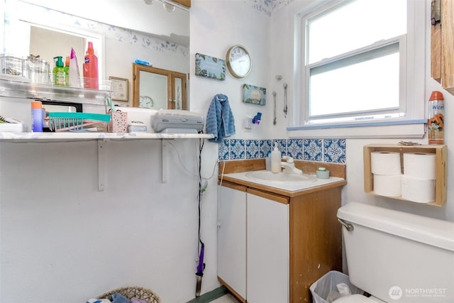 bathroom featuring toilet and vanity