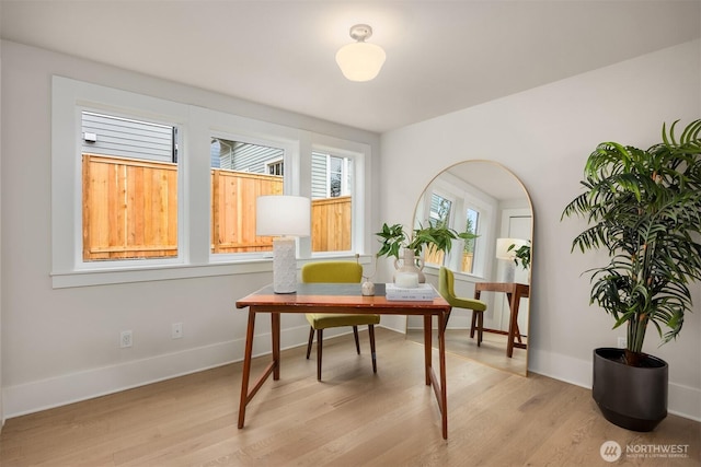 home office featuring light wood-style flooring and baseboards