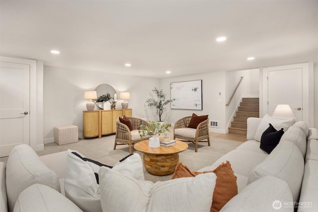 living room featuring recessed lighting, stairway, baseboards, and visible vents