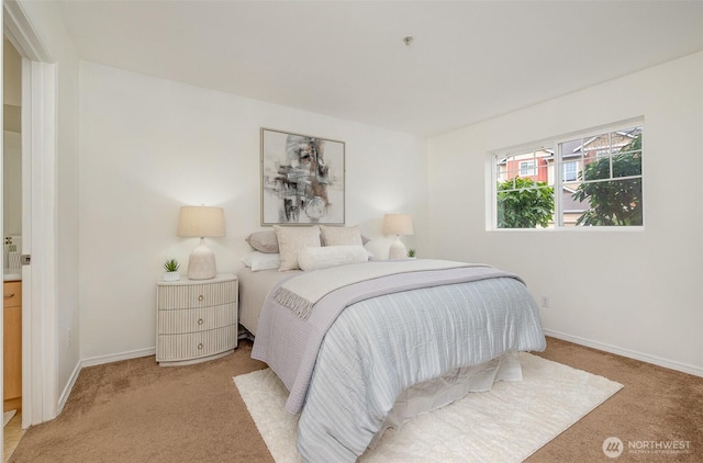 carpeted bedroom featuring baseboards