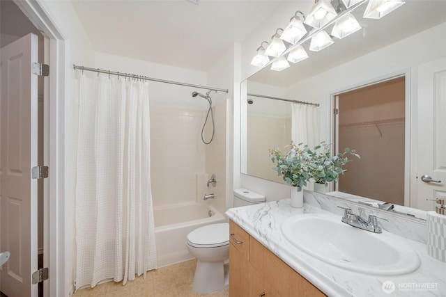 bathroom featuring toilet, vanity, and shower / bath combo