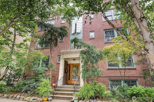 view of front of house featuring brick siding