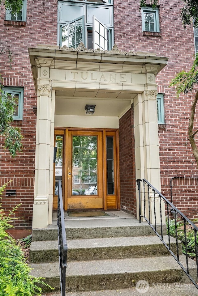 entrance to property with brick siding