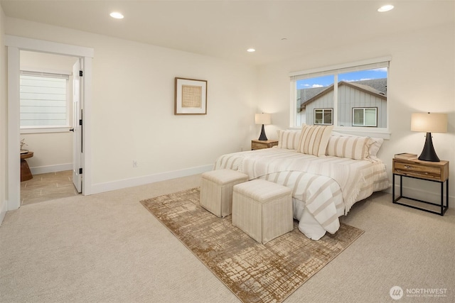 bedroom featuring recessed lighting, light colored carpet, and baseboards