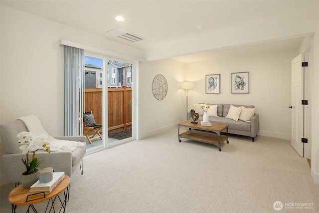 living room with visible vents, recessed lighting, baseboards, and carpet floors