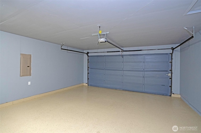 garage featuring electric panel, a garage door opener, and baseboards