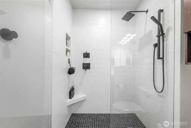 full bath with a tile shower