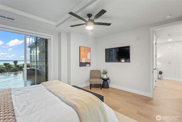 bedroom with light wood-type flooring, visible vents, baseboards, and access to outside