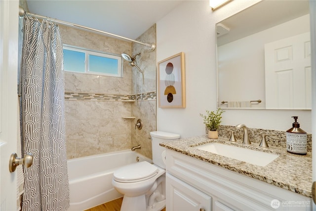 full bathroom featuring vanity, toilet, and shower / bath combo with shower curtain