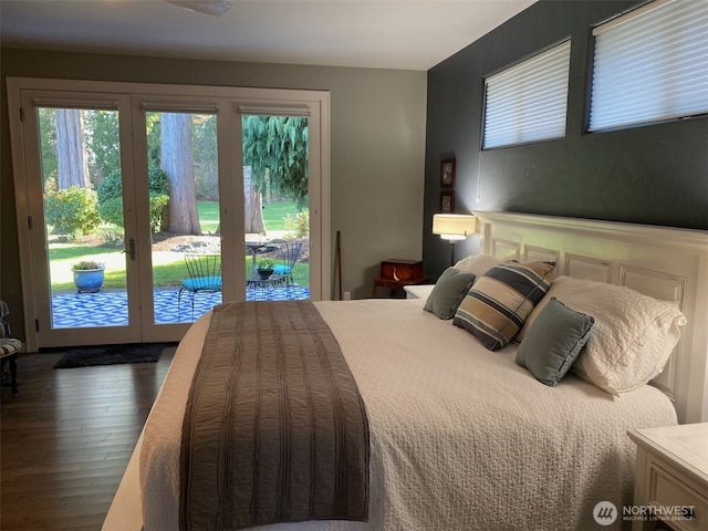 bedroom featuring access to exterior, wood finished floors, and french doors