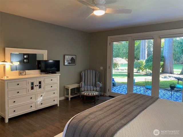 bedroom featuring dark wood finished floors, access to outside, multiple windows, and baseboards